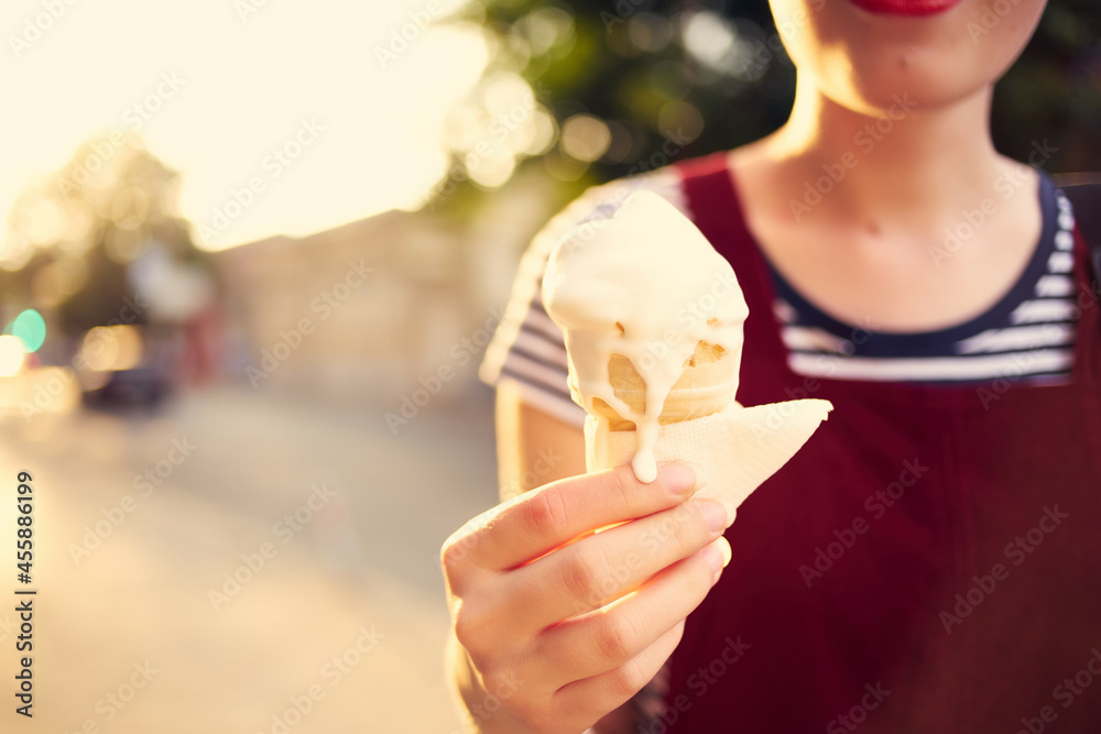 woman outdoors in summer eating ice cream vacation