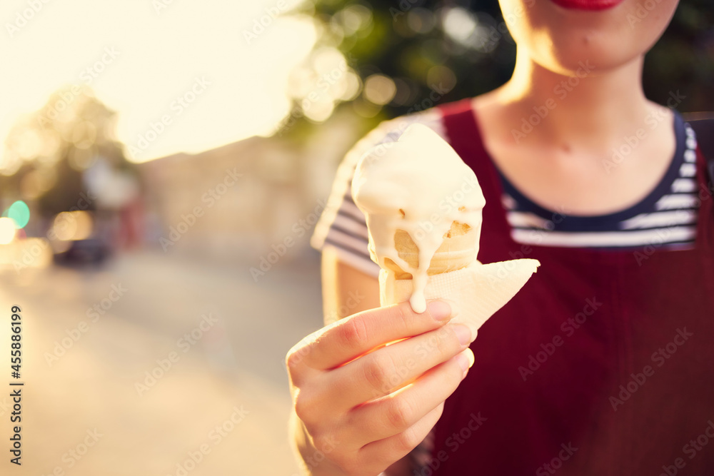 woman outdoors in summer eating ice cream vacation woman outdoors in summer eating ice cream vacation