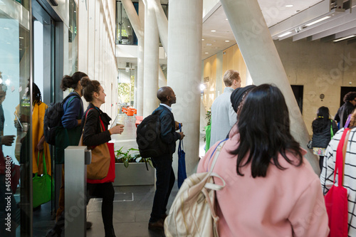 People entering auditorium hall