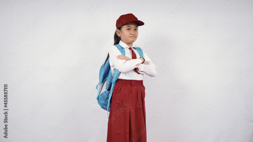 Beautiful elementary school girl feeling upset isolated on white background