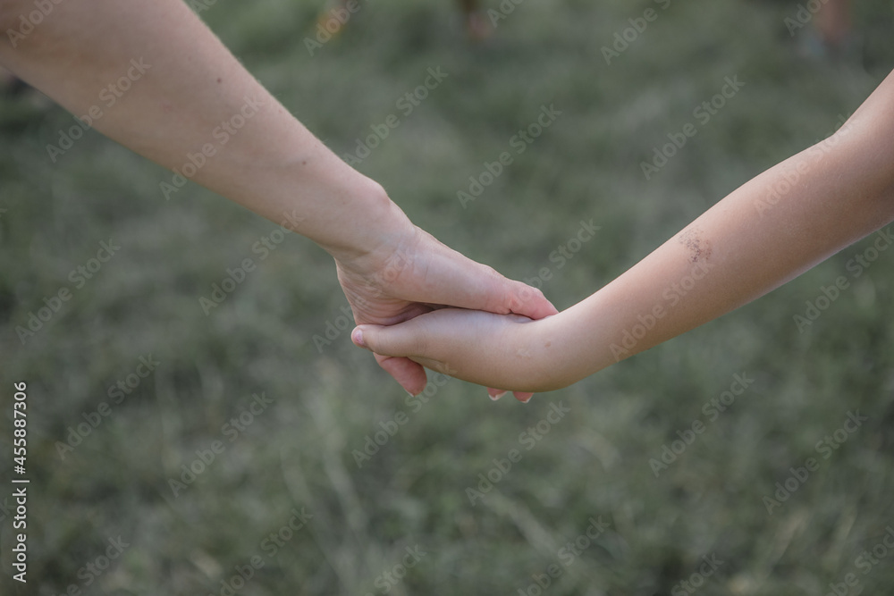 a two children holding hands. a two children holding hands.