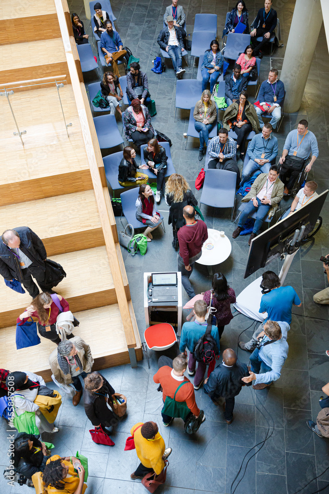 Obraz premium High angle view of people attending conference