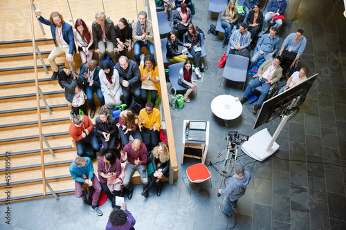 High angle view of people attending conference