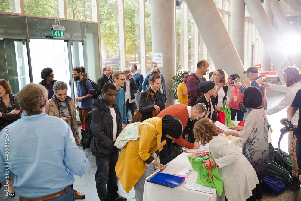 Fototapeta premium People signing up for conference