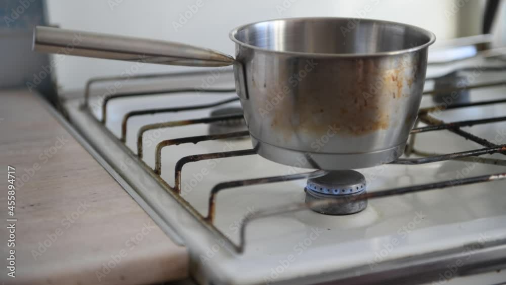 Hand Using Lighter Gun Filled with A Flammable Fluid or Pressurized