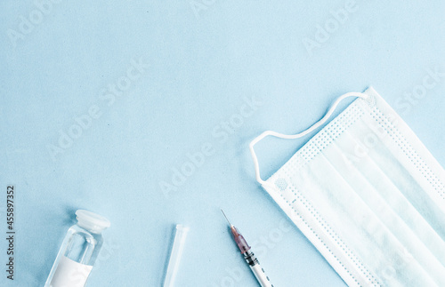 vaccine on a vial bottle and injection Syringe on a white table