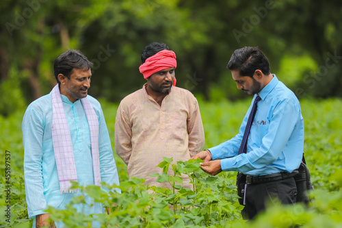 Indian farmer Discussing with agronomist at Farm and collecting some information