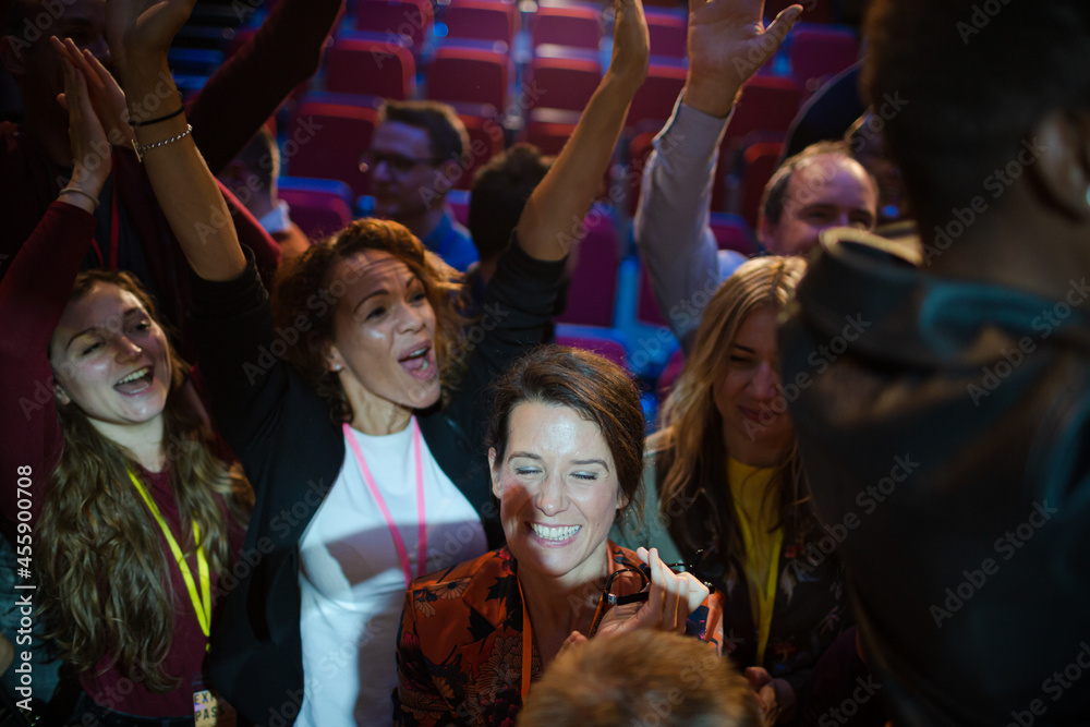 Enthusiastic woman cheering in audience Enthusiastic woman cheering in audience