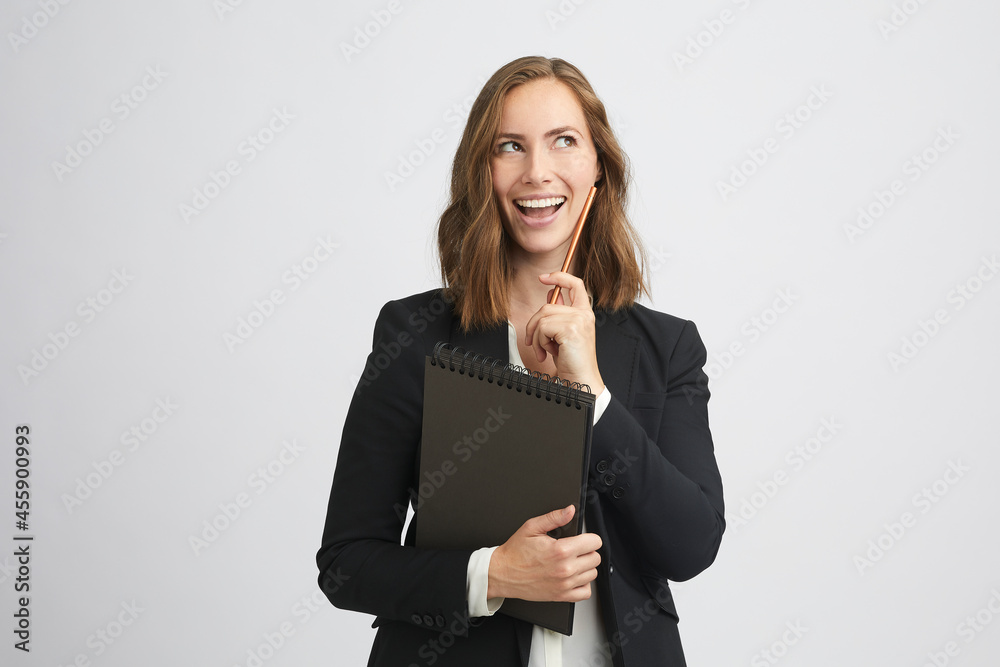 Funny portrait of a beautiful business woman with expression in her face - with a glimmer of hope while looking to the right Funny portrait of a beautiful business woman with expression in her face - with a glimmer of hope while looking to the right