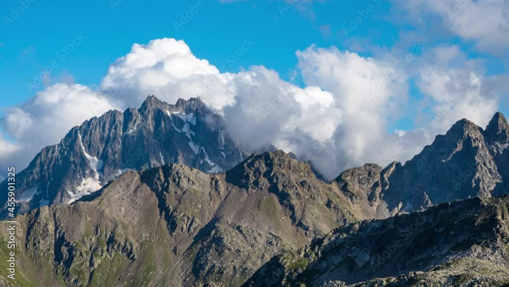 Puffy clouds over the mountains. Puffy clouds over the mountains.