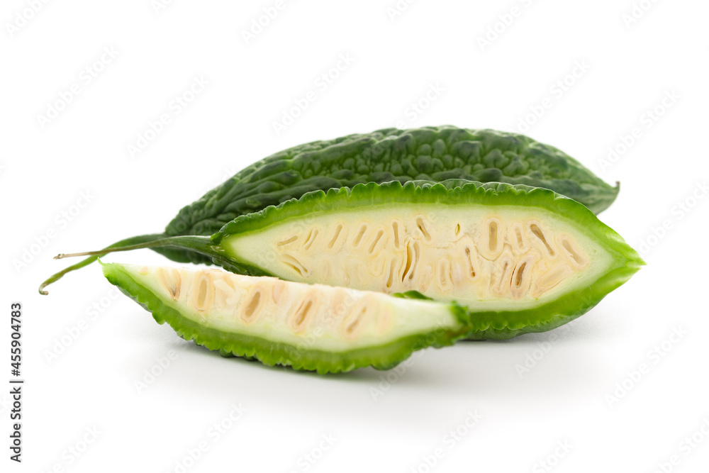 Close-Up of Organic Indian bitter gourds (Momordica charantia) or fresh Green Karela, cross section or vertical sliced, isolated over white. Close-Up of Organic Indian bitter gourds (Momordica charantia) or fresh Green Karela, cross section or vertical sliced, isolated over white.