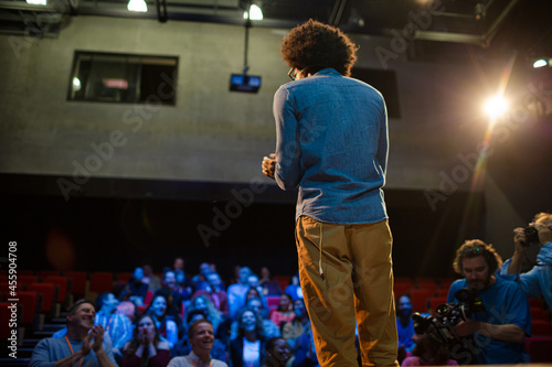Audience watching speaker on stage © KOTO