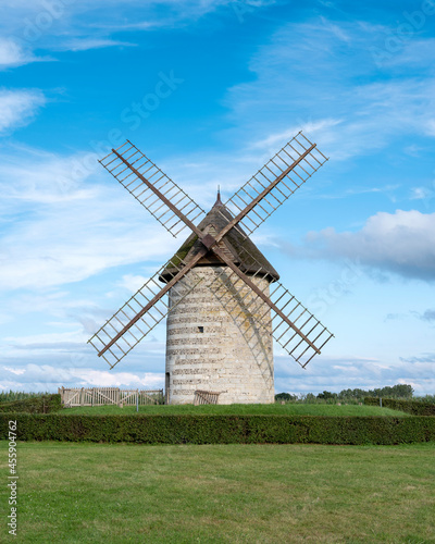 old windmill in french normandy under blue summer sky