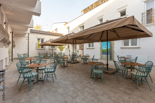 Empty terrace hotel restaurant with sun shades © rilueda