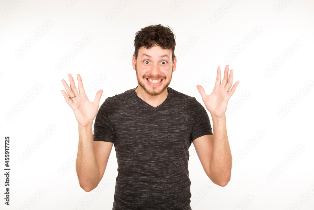 portrait isolated caucasian young man with surprised expression with hands up portrait isolated caucasian young man with surprised expression with hands up