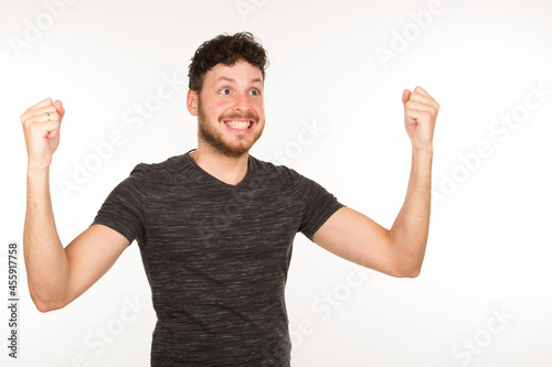 portrait isolated caucasian young man with triumphant expression