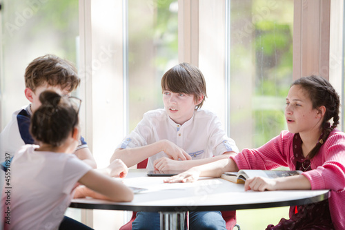 Students sitting together at table