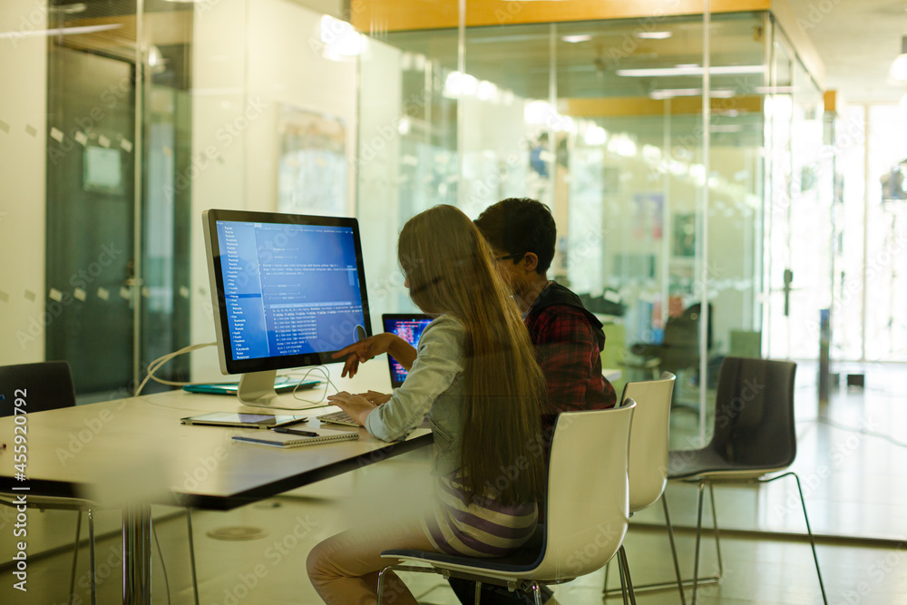 Students using computer at desk