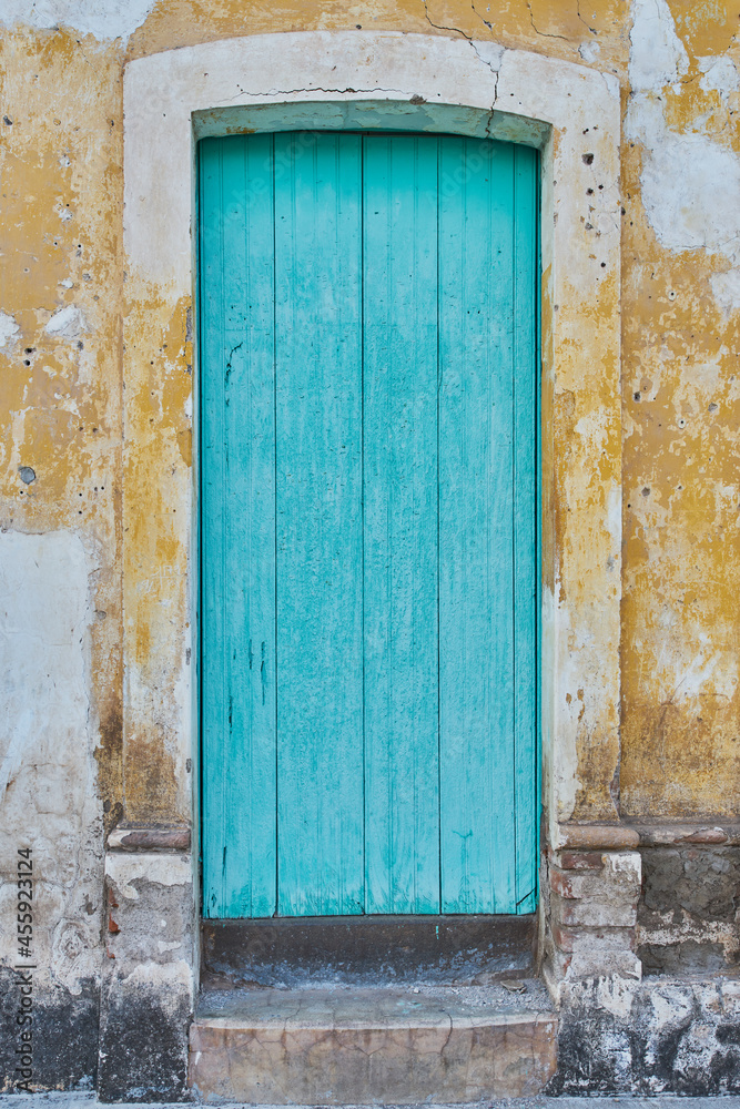 Light blue painted antique wooden door facade with copy space
