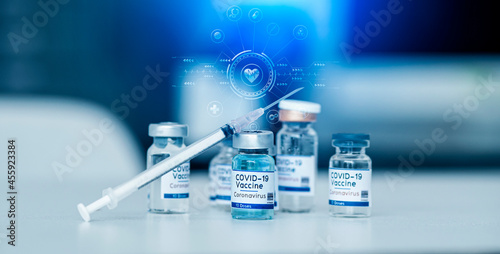 Medical doctor injecting coronavirus vaccine, COVID-19 vaccine, Medicine digital healthcare and connection on modern virtual screen. 