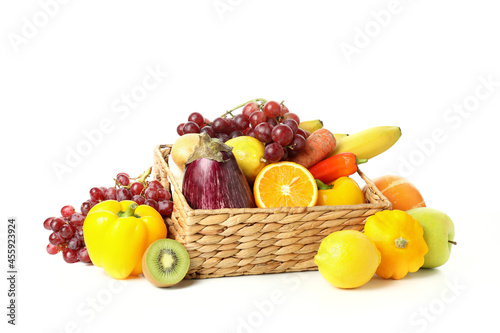 Basket with vegetables and fruits isolated on white background