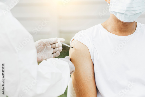 Medical doctor injecting coronavirus vaccine  COVID-19 vaccine  Medicine and healthcare. 