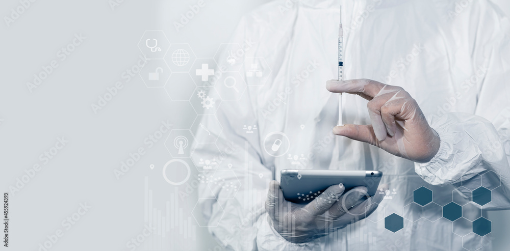 Medical doctor injecting coronavirus vaccine, COVID-19 vaccine, Medicine digital healthcare and connection on modern virtual screen. Medical doctor injecting coronavirus vaccine, COVID-19 vaccine, Medicine digital healthcare and connection on modern virtual screen.