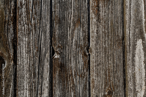 dark brown wooden wall made of dark planks vertical background