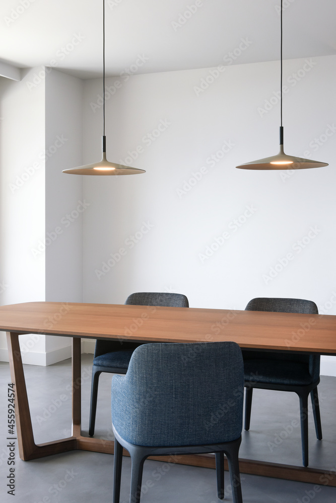 Luminous empty dining room with three chairs and two lamps Luminous empty dining room with three chairs and two lamps