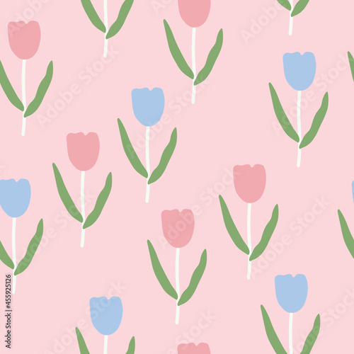 Seamless tulip pattern with blue and pink tulips and leaves on a light orange background.Flower background.Flower wallpaper.