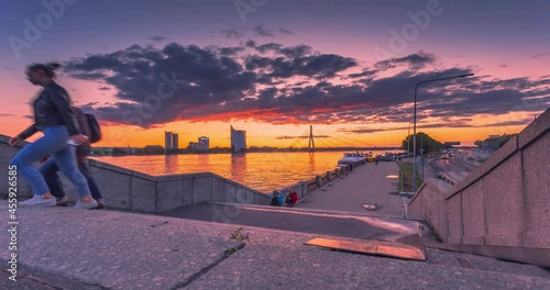 RIGA - LATVIA, people walking in the streets, sunset view with beautiful sky