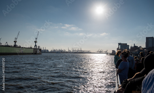 People on a sightseeing boat in the harbor of Hamburg, Germany.