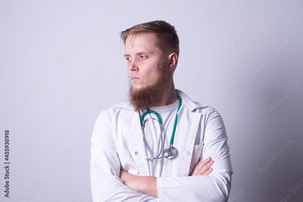 Male doctor in laboratory coat on gray background Male doctor in laboratory coat on gray background