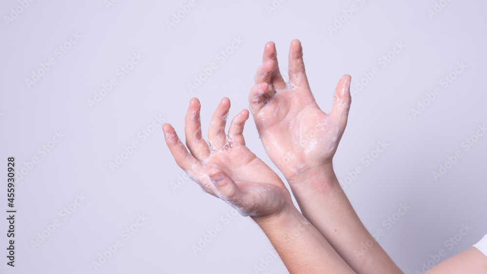 the man washes his hands with soap the man washes his hands with soap