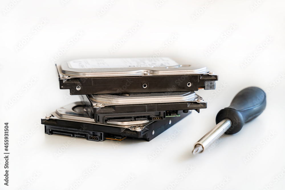 hdd disk and screwdriver hard disk repair on light background