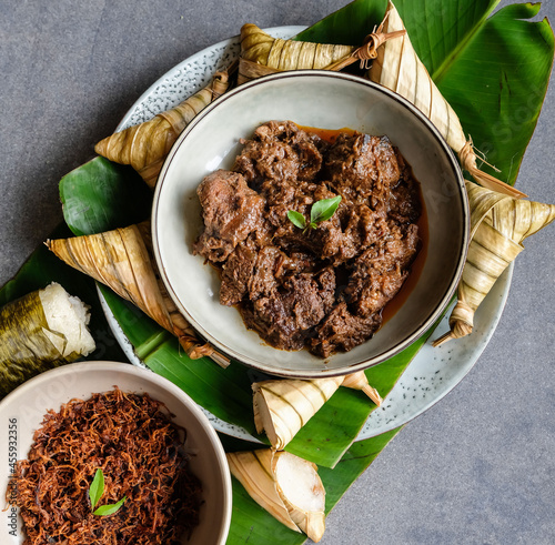 Popular food for breaking fast during Ramadan. Ramadan Food. Food like lemang, ketupat palas, beef and chicken rendang and serunding are commonly eaten together photo