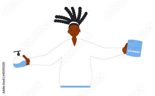 Portrait of woman with dark dreadlocks hair holding a shampoo co-wash and styling cream in her hands.