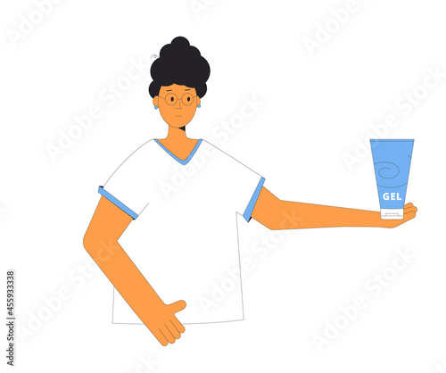 Portrait of woman with dark curly hair holding a bottle with hairstyling gel product.
