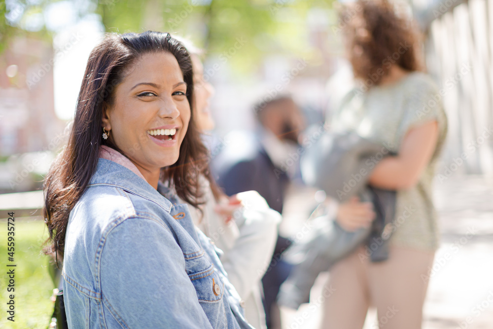 Portrait smiling, confident woman in sunny park Portrait smiling, confident woman in sunny park