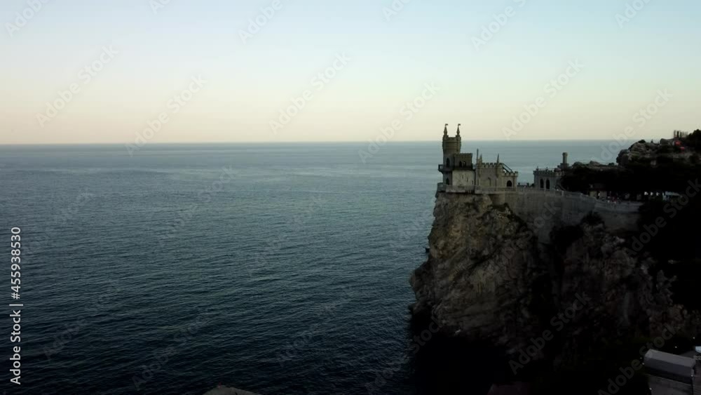 Castle on top of a cliff at sunset near the sea Castle on top of a cliff at sunset near the sea