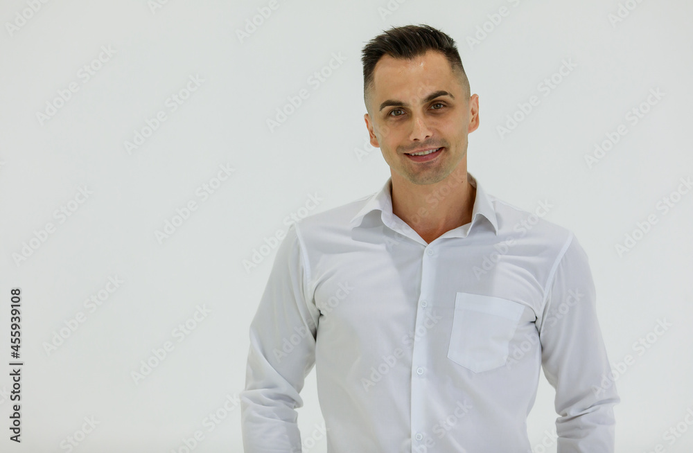Isolated portrait close up studio shot of Caucasian happy handsome smart confident professional successful businessman entrepreneur in long sleeve shirt stand smile look at camera on white background Isolated portrait close up studio shot of Caucasian happy handsome smart confident professional successful businessman entrepreneur in long sleeve shirt stand smile look at camera on white background