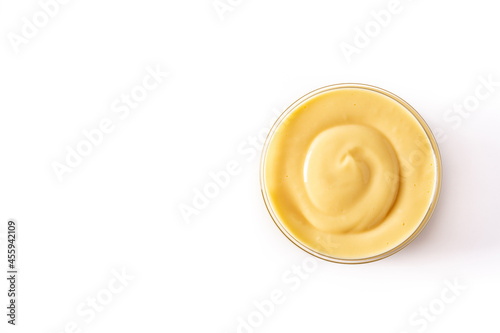 Pastry cream in a bowl isolated on white background. Top view. Copy space