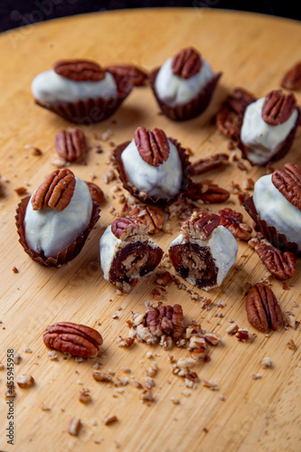 dates covered with white chocolate and stuffed with pecan