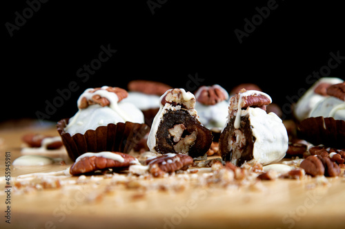 dates covered with white chocolate and stuffed with pecan