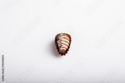 date dessert dipped in chocolate and garnished  Milk chocolate