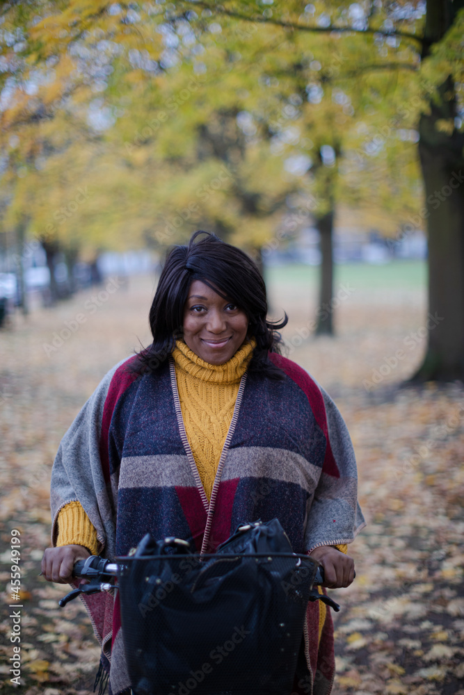 Portrait smiling, confident senior woman bike riding in autumn park Portrait smiling, confident senior woman bike riding in autumn park