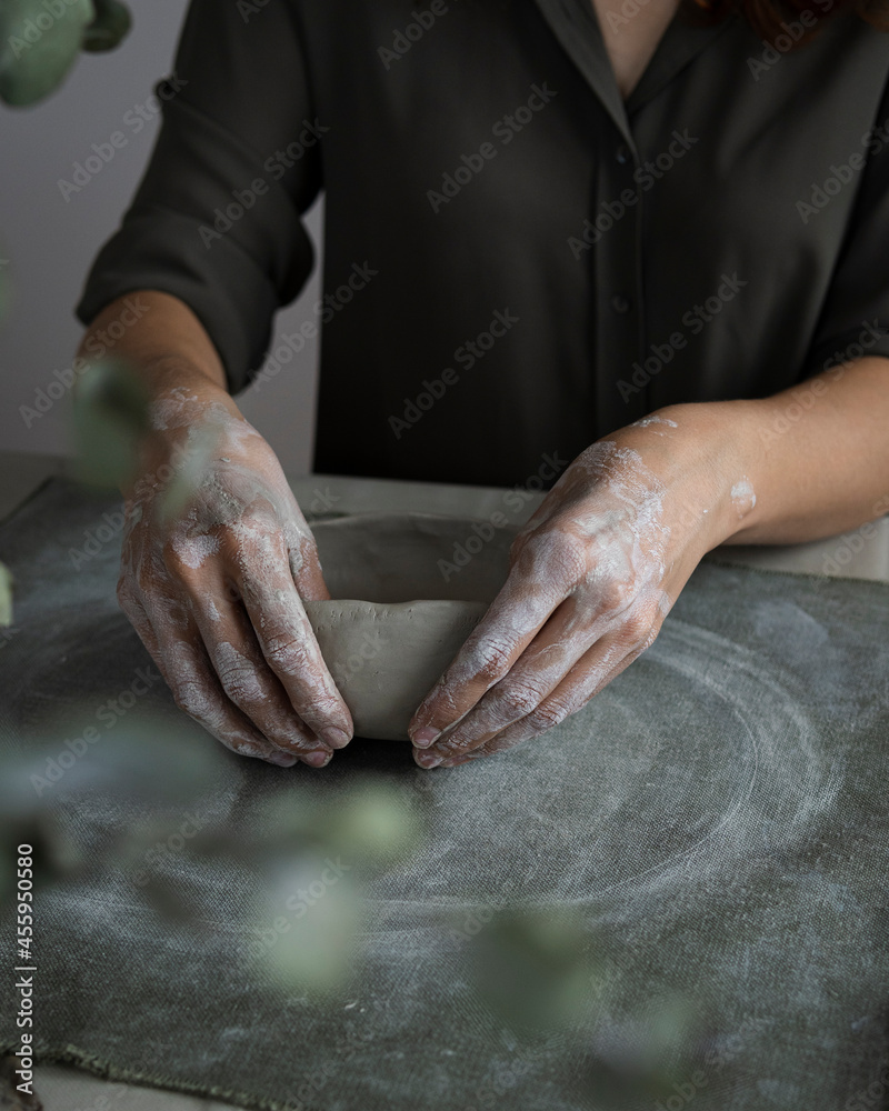 close up hands of a potter