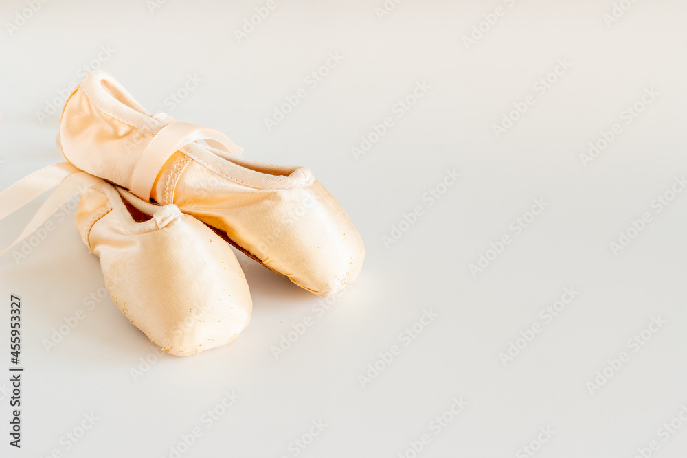 Pastel beige ballet pointe shoes or slippers with ribbon Pastel beige ballet pointe shoes or slippers with ribbon