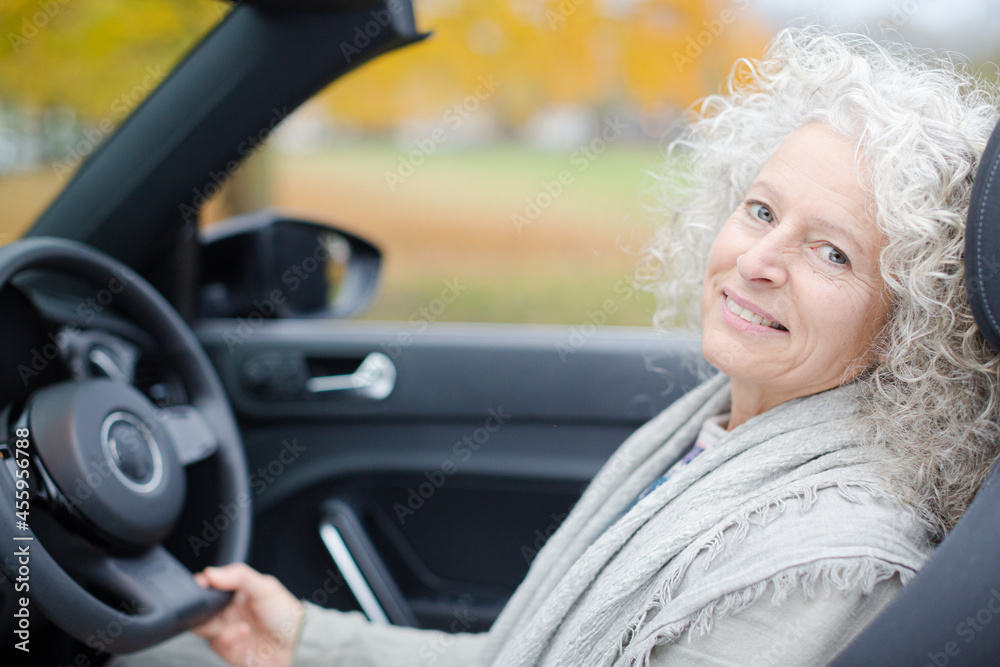 Portrait smiling, affectionate senior woman in car Portrait smiling, affectionate senior woman in car
