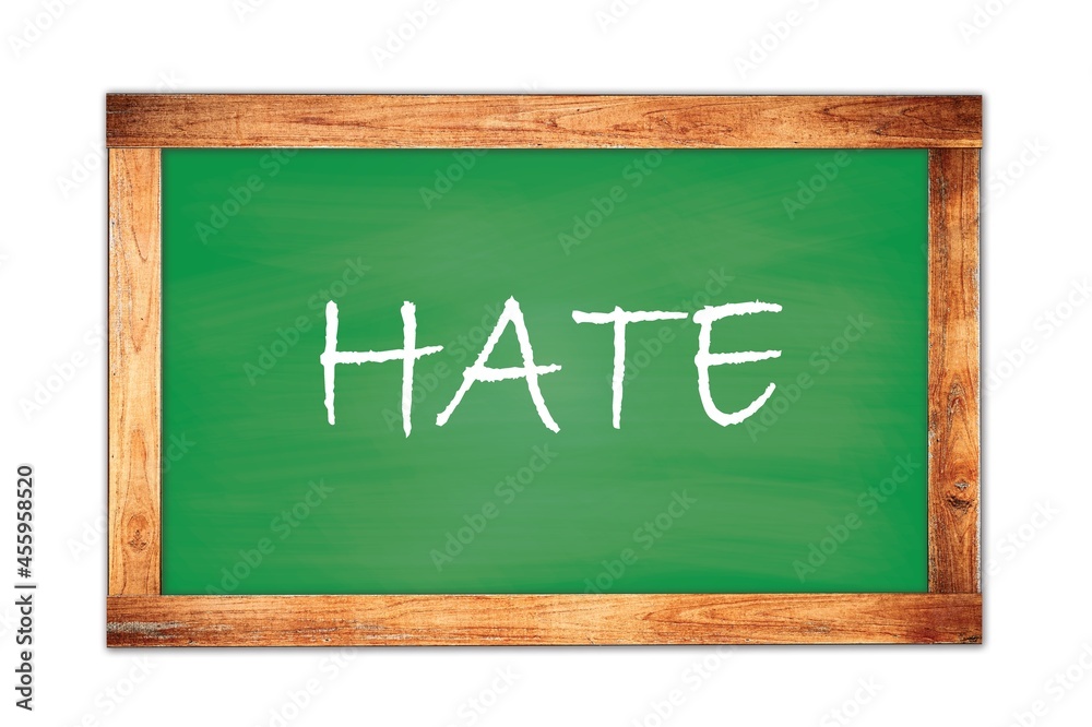 HATE text written on green school board. HATE text written on green school board.